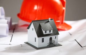 Construction helmet near some blueprints